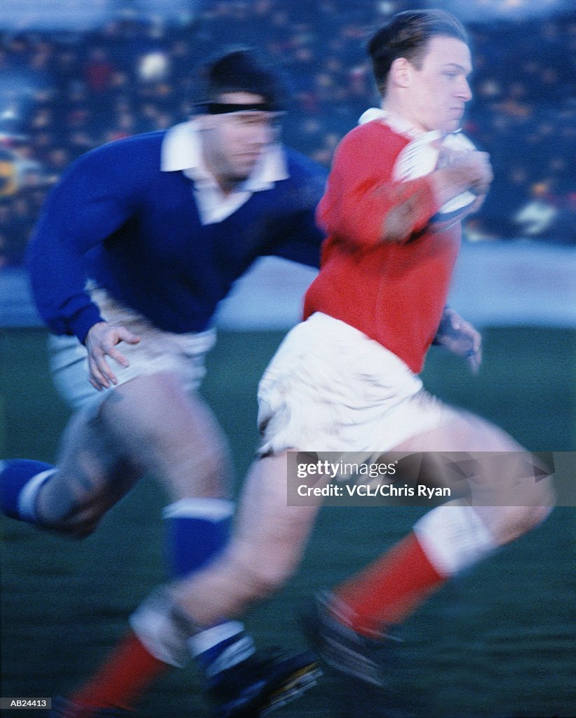 Rugby player running with the ball (blurred motion)