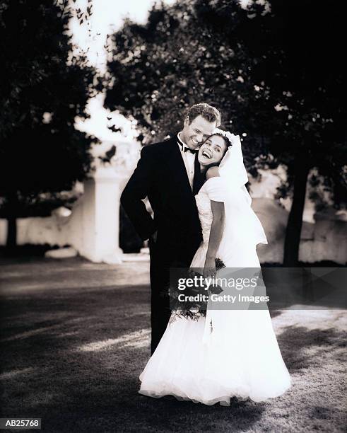 portrait of wedding couple - two toned dress stockfoto's en -beelden