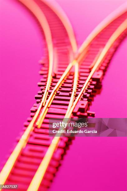 model train tracks, close-up (focus on junction, gel effect) - garcia stockfoto's en -beelden