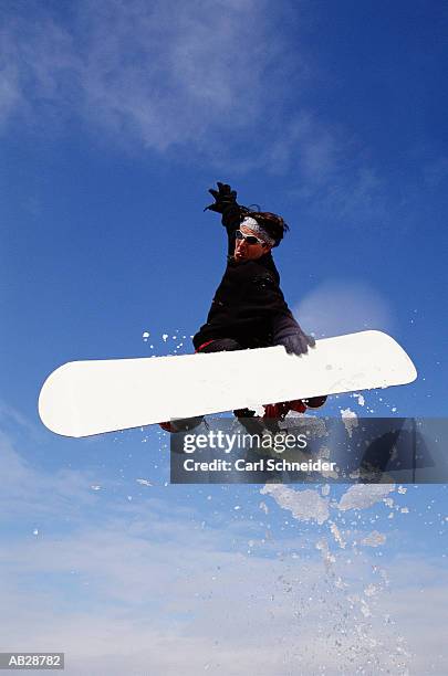 snow boarder twisting in mid-air - carl stockfoto's en -beelden