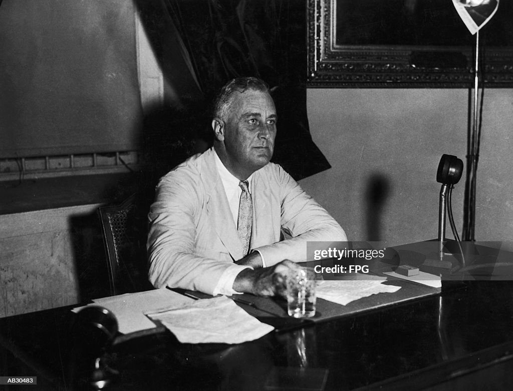 Franklin D. Roosevelt sitting behind desk (B&W)