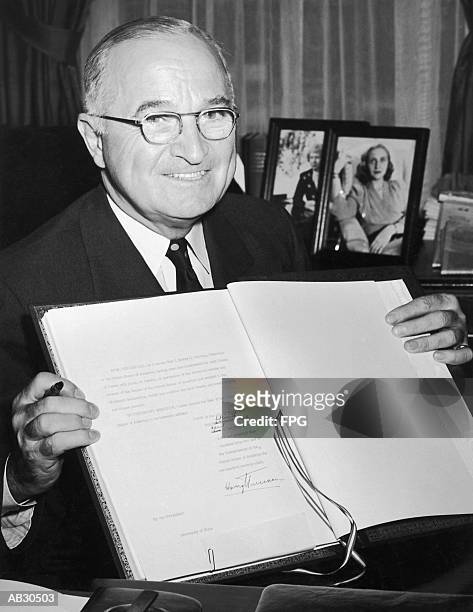 harry s. truman holding the nato agreement, portrait (b&w) - 20th century style stock pictures, royalty-free photos & images