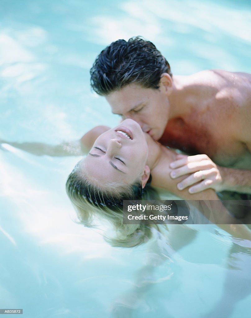 Couple embracing in water