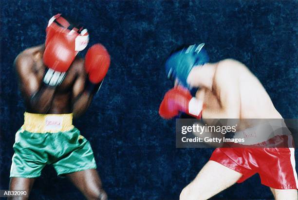 two boxers fighting - amateur boxer stock pictures, royalty-free photos & images