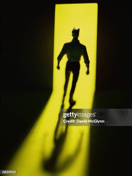 Figurine Of Man In Doorway Silhouette, Foto de stock