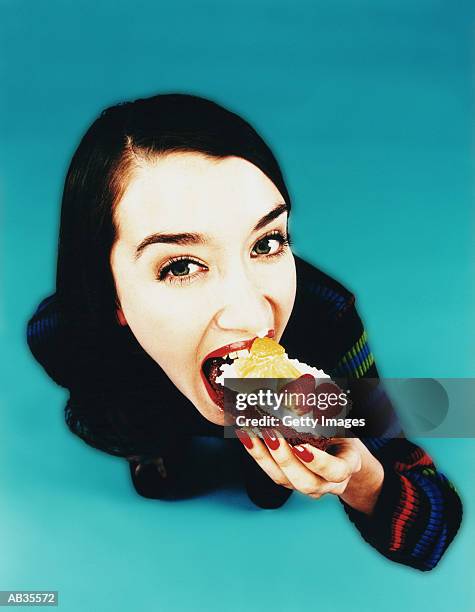 woman eating gateau, close up - wide angle stock-fotos und bilder