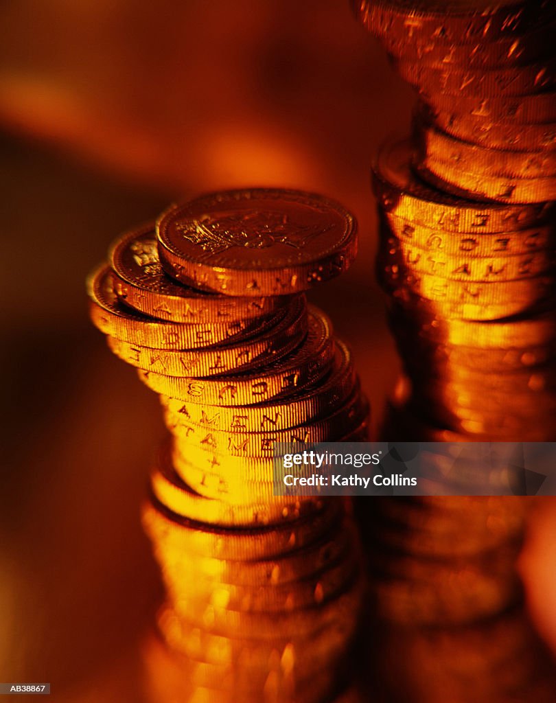 Two stacks of pound coins, close-up