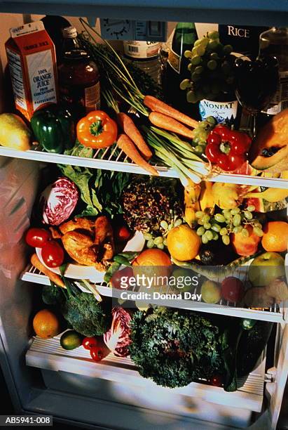 refrigerator full of fruit and vegetables, close-up - full fridge stock-fotos und bilder