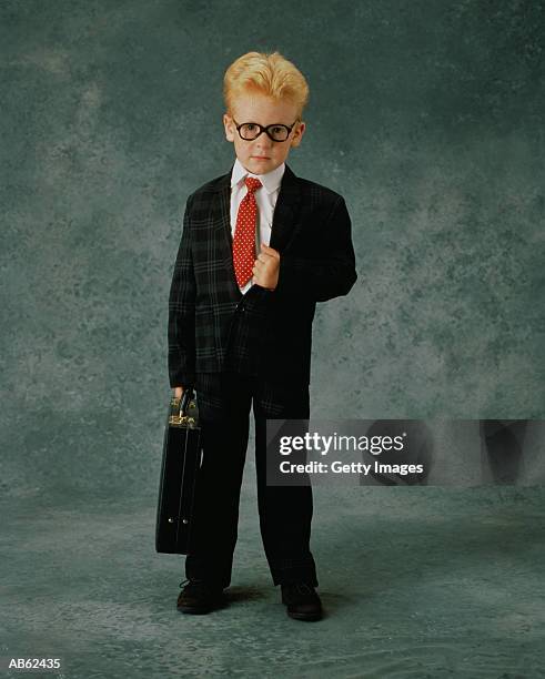 boy (3-5) dressed as business man with briefcase, portrait - adult imitation stock pictures, royalty-free photos & images