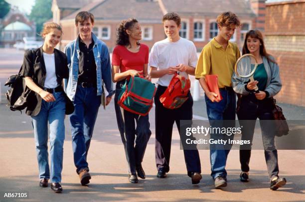 teenagers (16-18) walking through school yard - vian stock pictures, royalty-free photos & images