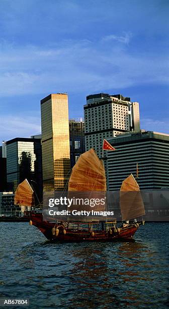 chinese junk boat sailing in harbor, hong kong, china - junk ストックフォトと画像