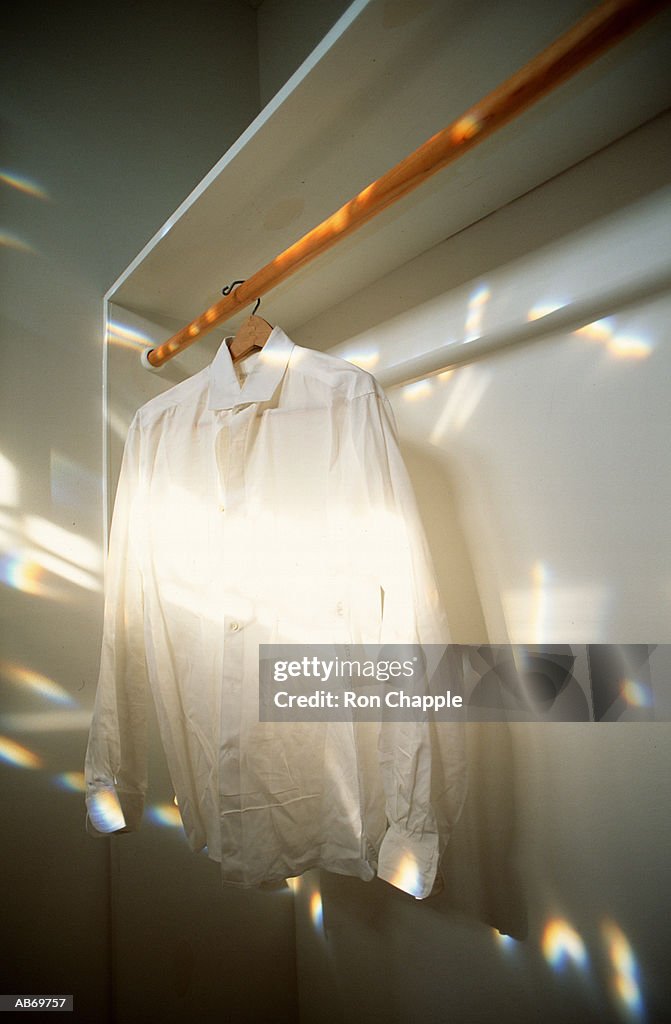 Shirt hanging in closet