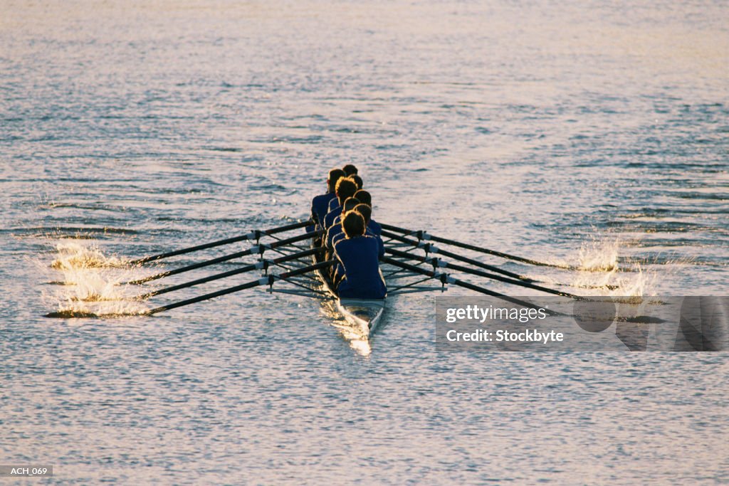 Rowers in eight-person racing shell