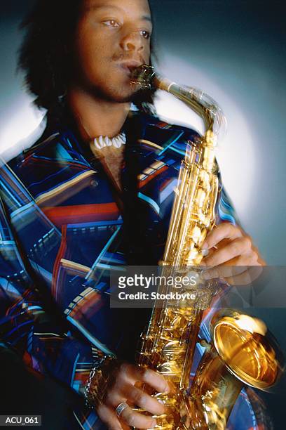 man playing saxophone - saxophone player stock pictures, royalty-free photos & images