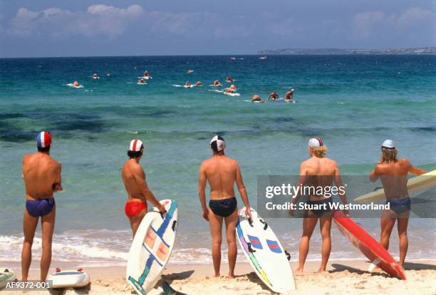 australia,sydney,competitors in bondi beach lifeguard race - bondi beach stock pictures, royalty-free photos & images