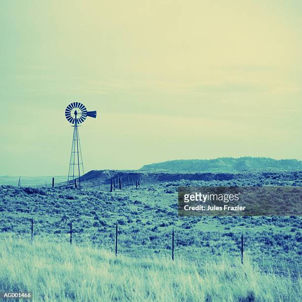 desert landscape with windmill - mulino a vento stile americano foto e immagini stock