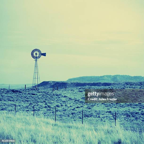 desert landscape with windmill - 工業用風車 ストックフォトと画像