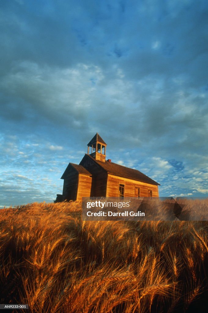 Old schoolhouse in wheat field, autumn, Washington, USA