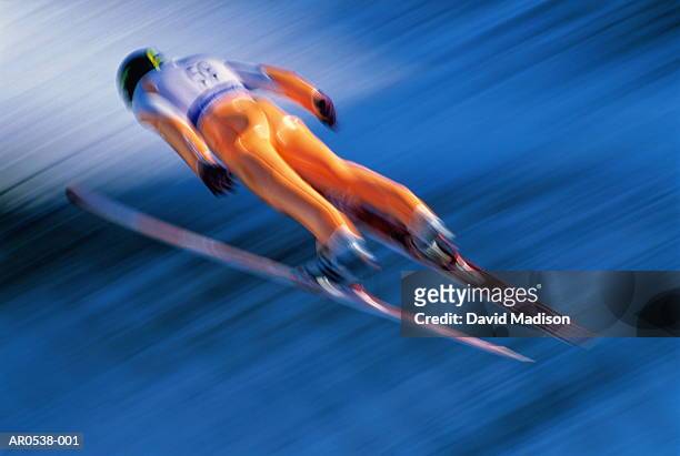 ski-jumping (blurred motion) - ski jumping stock-fotos und bilder