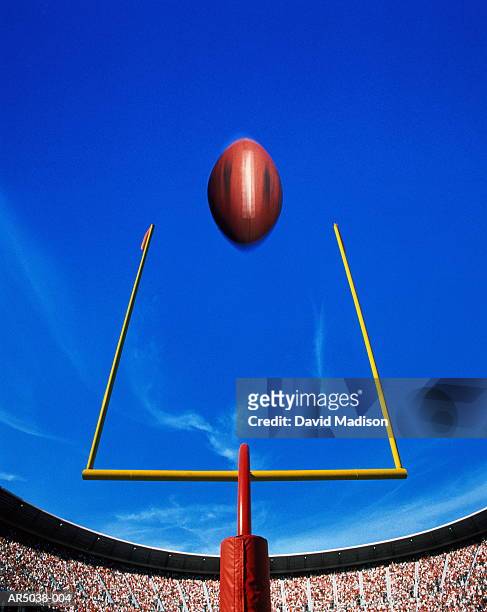 american football, ball flying over goal (digital composite) - football goal post stock pictures, royalty-free photos & images