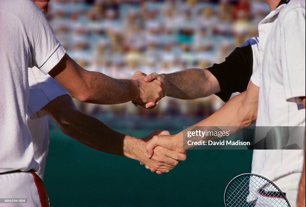 Four tennis players shaking hands after match (Digital Composite)