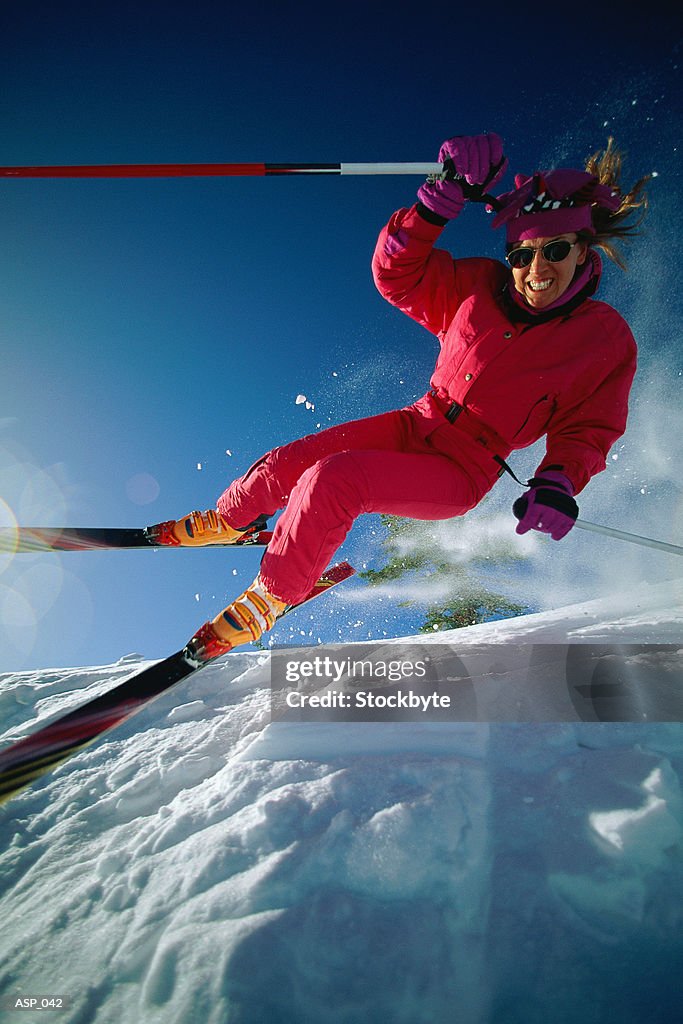 Person downhill skiing