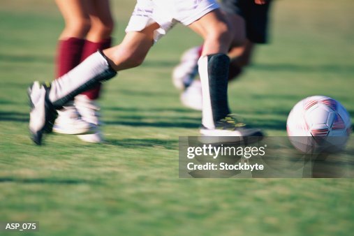 Close-up of soccer players feet and ball Close-up of soccer players feet and ball