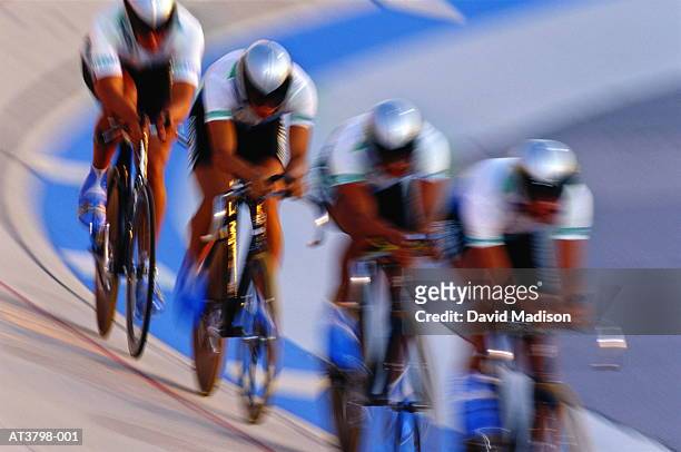 cyclists racing in velodrome (blurred motion) - match sport stockfoto's en -beelden
