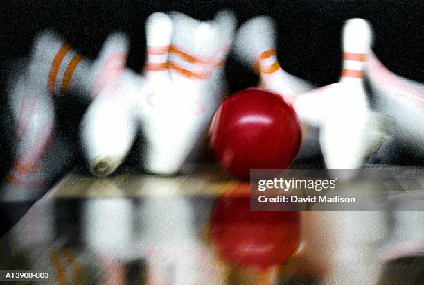 bowling ball striking pins, close-up (digital composite) - bowl stock pictures, royalty-free photos & images