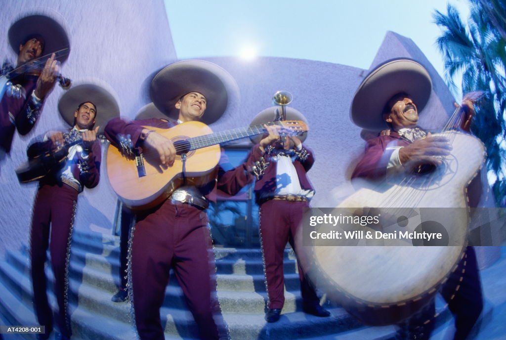 Mexico, Oaxaca, Mariachi band performing on stairway (wide angle)