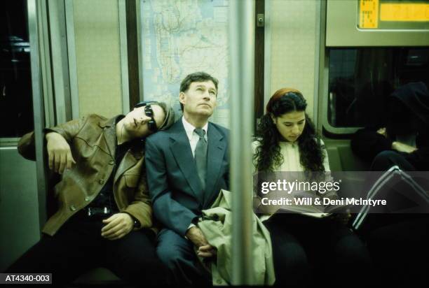 business executive riding subway train, new york city, usa - routine bildbanksfoton och bilder