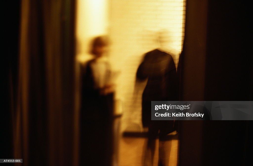 People standing in doorway, defocussed