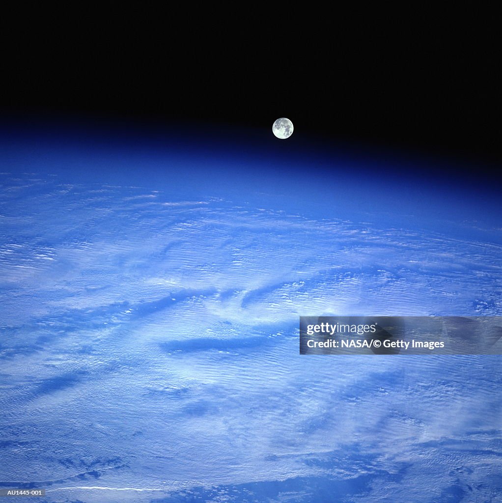 Full moon setting over Pacific Ocean, satellite view (Enhancement)