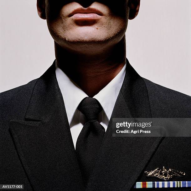 young man wearing military uniform, close-up, mid section - military uniform close up stock pictures, royalty-free photos & images