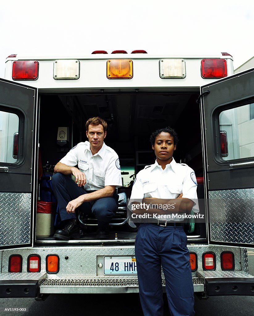 Paramedics at rear of ambulance