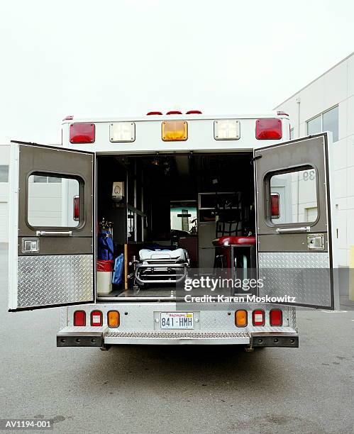 ambulance with rear doors open - ambulance imagens e fotografias de stock