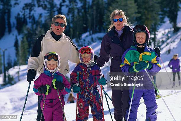 family skiing - スキーパンツ ストックフォトと画像