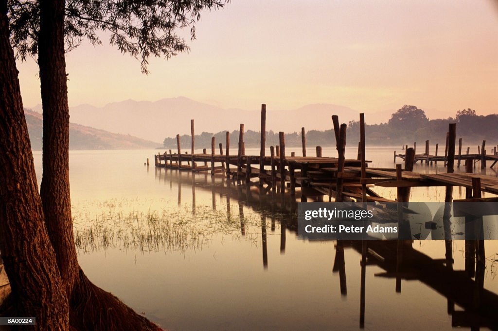 JETTY INTO LAKE PANAJCHEL AT SUNSET / GUATEMALA