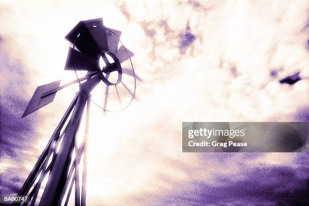 windmill, low angle view (digital enhancement) - mulino a vento stile americano foto e immagini stock