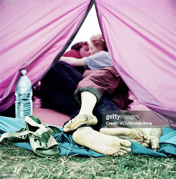 coule kissing in tent - kissing feet stock pictures, royalty-free photos & images