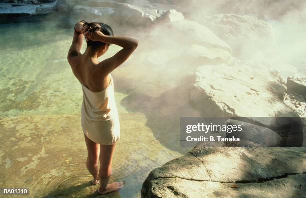 woman standing in hot spring, elevated view - tanaka stock pictures, royalty-free photos & images