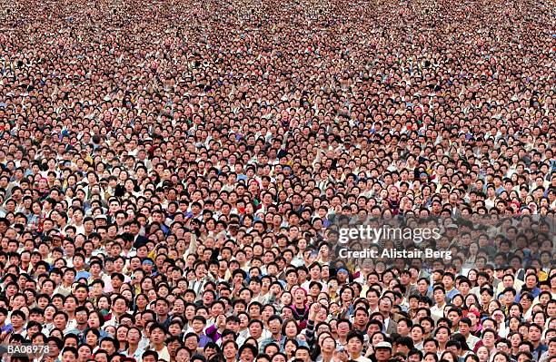 crowd of people looking upward, elevated view (digital composite) - crowd looking up stock pictures, royalty-free photos & images