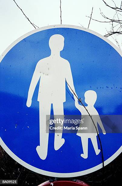 adult and child pedestrian crossing sign, close-up - marea stock pictures, royalty-free photos & images