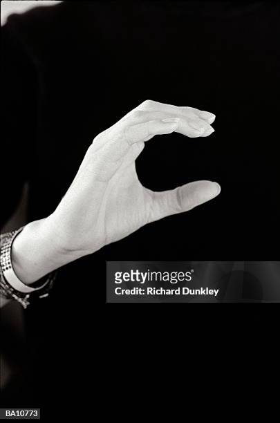 man signing letter c in british sign language, close-up (b&w) - w hand sign stock pictures, royalty-free photos & images