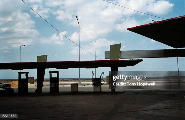 petrol station by coast, havana, cuba - hopewell stock pictures, royalty-free photos & images