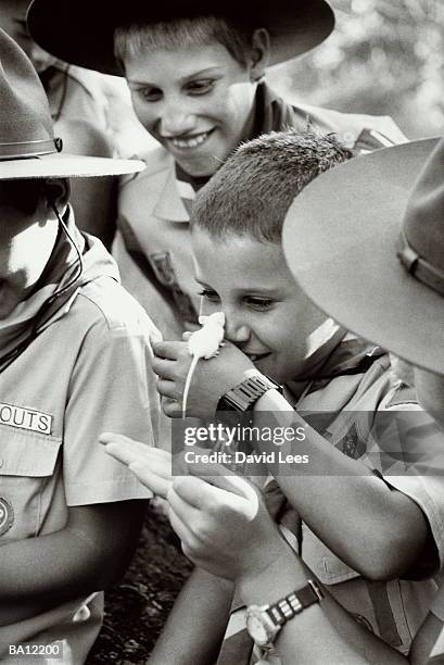 group of cub scouts playing with field mice, close-up (b&w) - feldmaus stock-fotos und bilder