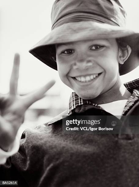boy (8-10) making peace sign, close up, portrait (b&w) - w hand sign stock pictures, royalty-free photos & images