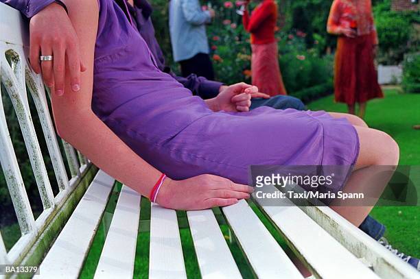 couple on bench at party, low section - marea stock pictures, royalty-free photos & images