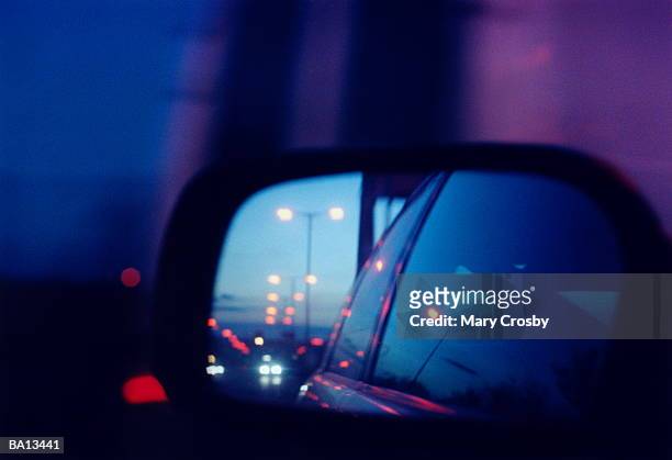 car side mirror reflecting section of car and traffic - crosby imagens e fotografias de stock