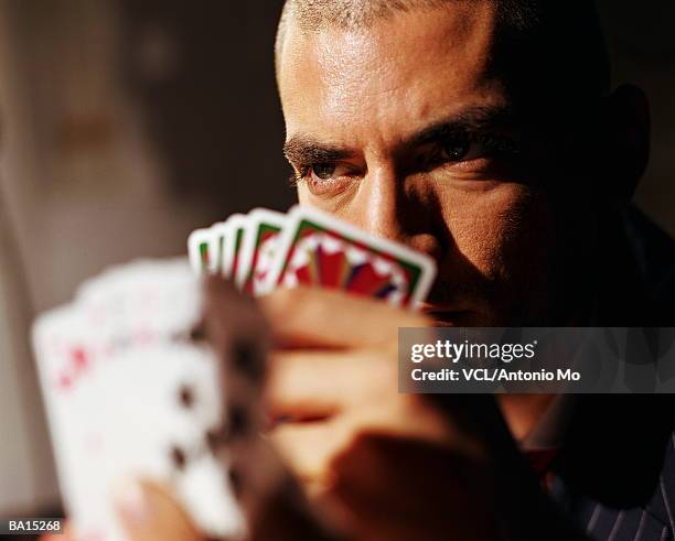 man holding playing cards, close up - antonio stock pictures, royalty-free photos & images